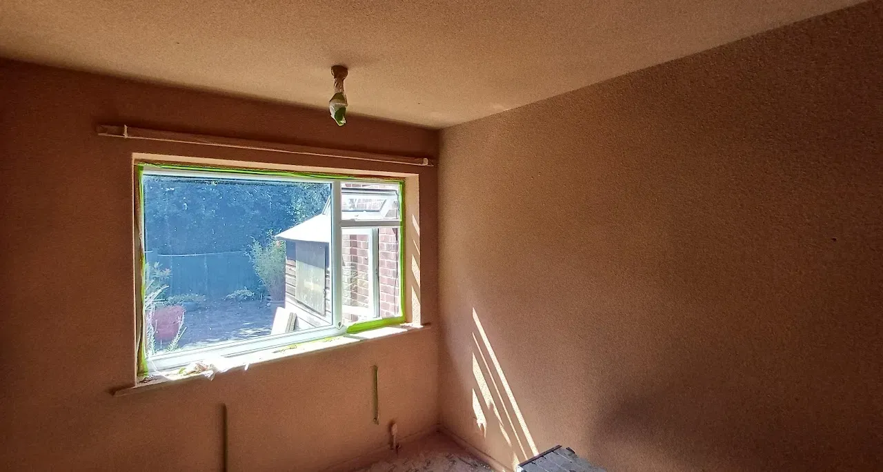 Freshly floated and browned bedroom walls ready for skimming